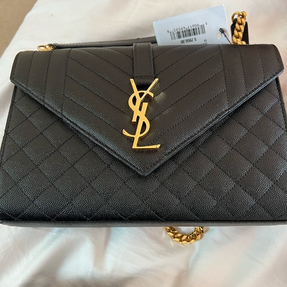 I just added this listing on Poshmark: YSL LARGE envelope chain bag in  black. #shopmycloset #poshmark #fashio…